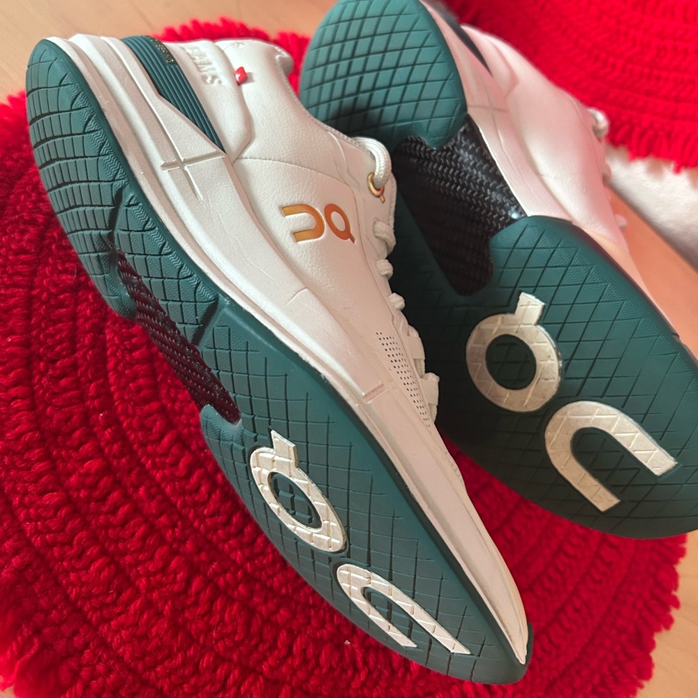 On Running White and Teal Athletic Shoes